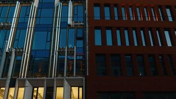 Close up of a skyscraper facade with numerous windows in the city video