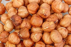 macro hazelnuts nuts on a white background photo