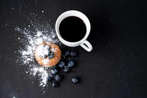 Blueberry antioxidant organic superfood and sweet muffin with cup of coffee photo