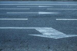 Road lanes with arrow markings photo