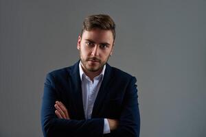 Close up portrait young man businessman. Caucasian guy business suit studio gray background. photo