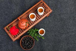 Traditional Chinese tea ceremony with black currant, fruit tea and healthy food. Photo without people. Summer natural vitamins and berries