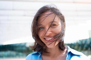 Businesswoman portrait. Caucasian female business person standing outdoor looking at camera close up face. Young beautiful modern business woman 30s years. Confidence employer smile photo