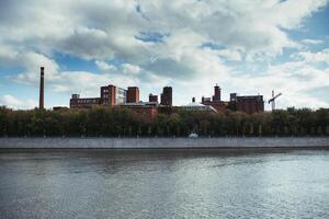 factory building on the Moscow river in Russia photo