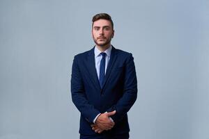 Close up portrait young man businessman. Caucasian guy business suit studio gray background. photo