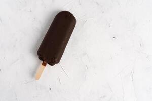 ice cream stick  on dark white background  covered chocolate sticks frozen Popsicle and Lolly sweet dessert  Flat lay photo