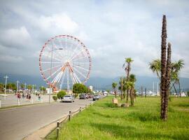 Batumi, GEorgia - 29 August 2018 Ferris wheel with cloud sky on the background photo