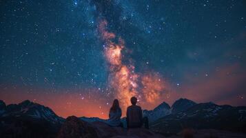 ai generado dos personas en pie en parte superior de un montaña mirando a el estrellas foto