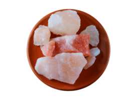 Himalayan pink salt rock in orange plate isolated on a transparent background, png