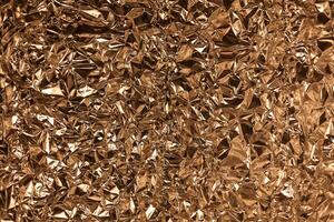 Full frame take of a sheeT of crumpled gold aluminum foil photo