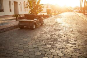 Staff electric car near the hotel in tropical photo