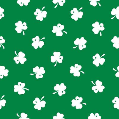 Seamless pattern with a small white clover on a green background. Happy St. Patrick's Day. Suitable for textile, wrapper, cover, brochure, wallpaper, website or banner. Vector illustration.