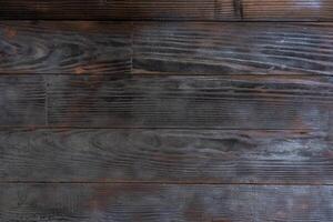 BBQ background. Burnt wooden Board texture. Burned scratched hardwood surface. photo