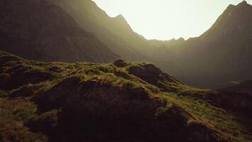 The sun shines through the mountains on a sunny day video