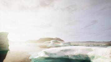 A group of icebergs floating on top of a body of water video