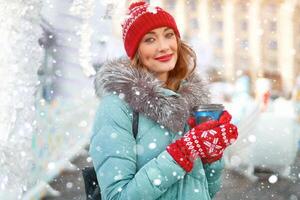 Beautiful lovely middle-aged girl with curly hair warm winter jackets stands background Town Square. photo