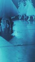 Ballerinas run in a circle on the stage. Close-up of the legs. Vertical format for the phone. video