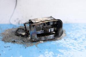 Toaster after fire. Household electrical appliance fire hazard photo