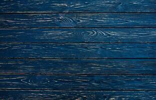 Dark black wood texture background viewed from above. The wooden planks are stacked horizontally and have a worn look. photo