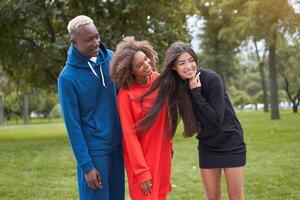 Multi ethnic friends outdoor. Diverse group people Afro american asian spending time together photo