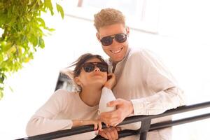 Happy cheerful couple in sunglasses photo