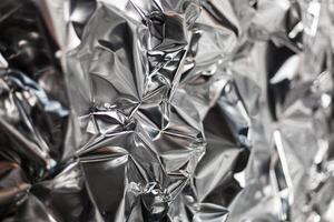 Full frame take of a sheeT of crumpled silver aluminum foil photo