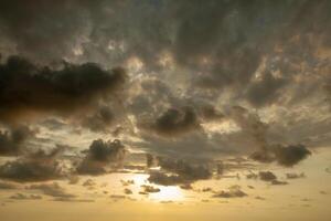 Fantastic sky, dramatic sunset, beautiful natural background. Setting sun illuminates the clouds. photo