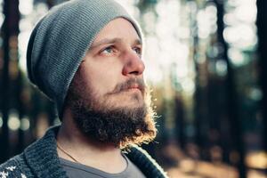 Outdoor portrait of handsome bearded man . Casual autumn fashion portrait photo