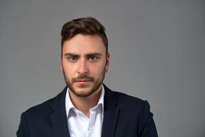 Close up portrait young man businessman. Caucasian guy business suit studio gray background. photo