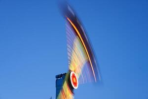 Amusement park blurred effect. Abstract illuminated background photo