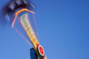 Amusement park blurred effect. Abstract illuminated background photo