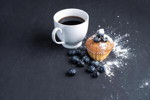 Blueberry antioxidant organic superfood and sweet muffin with cup of coffee photo