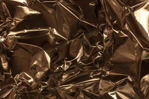 Full frame take of a sheeT of crumpled gold aluminum foil photo