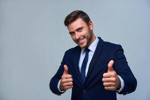 Close up portrait young man businessman. Caucasian guy business suit studio gray background. photo