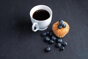 Blueberry antioxidant organic superfood and sweet muffin with cup of coffee photo