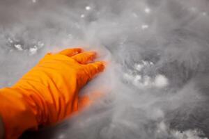 Thick white smoke on a background of black ceramic tiles. photo