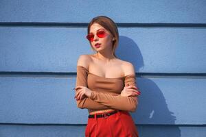 Beautiful young Caucasian woman walks streets of the city warm summer sunny day . photo