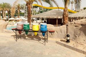 different colors bins for collect recycle materials photo