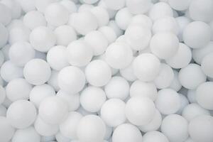 Many white plastic balls for dry pool. photo