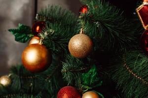 Christmas toy on the Christmas tree. Decorated Christmas tree ball. Christmas ball close up. Selective focus. photo