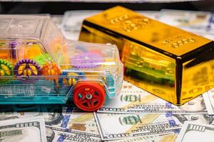 Dollars with gold and car symbols of luxury with business success concept of economic investment photo