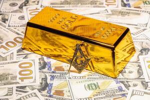 Gold and dollars concept of financial wealth and business success with Masonic sign photo