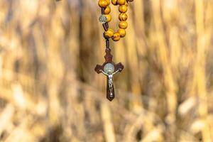 Religious Christian theme with Biblical concept of Jesus Christ crucified on the cross for the holiday of Palm Sunday or Christmas photo