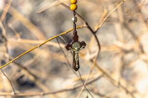 Religious Christian theme with Biblical concept of Jesus Christ crucified on the cross for the holiday of Palm Sunday or Christmas photo