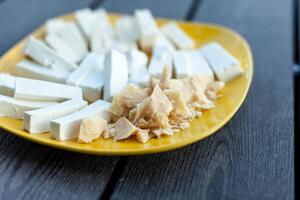 Cheese Assortment on a dark background, selective focus photo