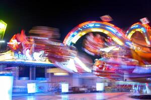 Amusement park blurred effect. Abstract illuminated background photo