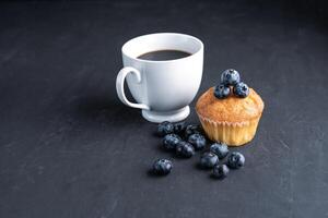 Blueberry antioxidant organic superfood and sweet muffin with cup of coffee photo