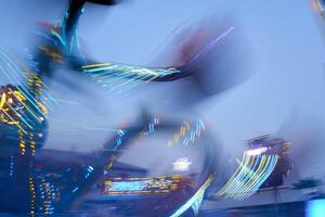 Amusement park blurred effect. Abstract illuminated background photo