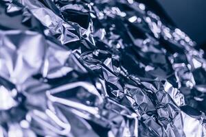 Full frame take of a sheeT of crumpled blue aluminum foil photo