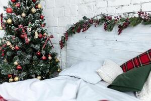 New year bedroom interior. Bed with cozy cushions photo